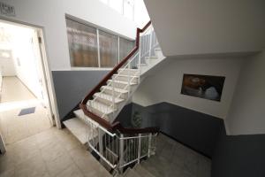 
a stairway leading up to a room with stairs at The Story Guest House in Faro
