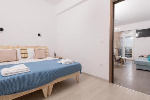 Posteľ alebo postele v izbe v ubytovaní Marion Apartments
