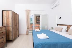 Posteľ alebo postele v izbe v ubytovaní Marion Apartments