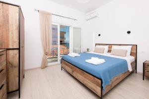 Posteľ alebo postele v izbe v ubytovaní Marion Apartments