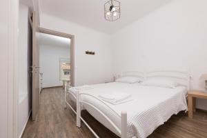 Posteľ alebo postele v izbe v ubytovaní Marion Apartments