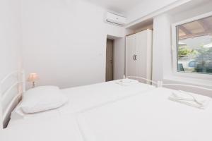 Posteľ alebo postele v izbe v ubytovaní Marion Apartments