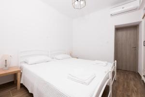 Posteľ alebo postele v izbe v ubytovaní Marion Apartments