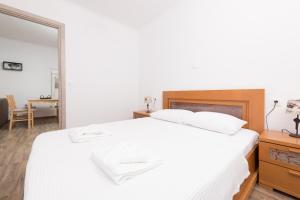 Posteľ alebo postele v izbe v ubytovaní Marion Apartments