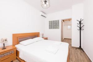 Posteľ alebo postele v izbe v ubytovaní Marion Apartments