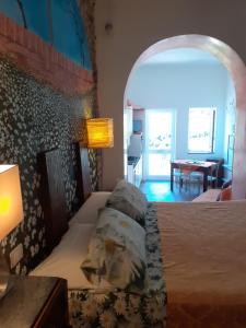 a bedroom with a bed and a room with a table at Scaglie di Mare in Manarola