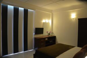 Μια τηλεόραση ή/και κέντρο ψυχαγωγίας στο Panoramic Holiday Apartment - Luxury Studio | Nuwara Eliya