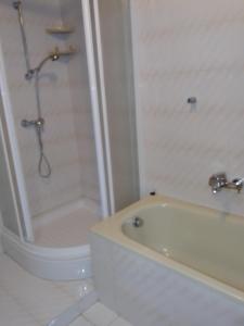 a bathroom with a shower and a tub and a sink at Guest Accommodation Palma in Portorož +25 photos