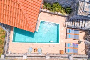 an overhead view of a swimming pool next to a house at Acrothea Villa Heated Pool in Chania Town