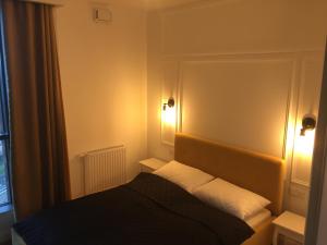 Posteľ alebo postele v izbe v ubytovaní Kraków City Center Luxury Apartment