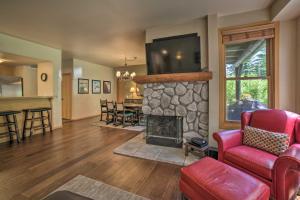 a living room with a fireplace and a tv at Mammoth Lakes Vacation Rental with Community Hot Tub in Mammoth Lakes