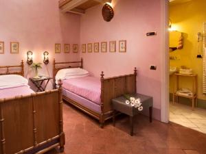 Postel nebo postele na pokoji v ubytování Graziella Patio Hotel