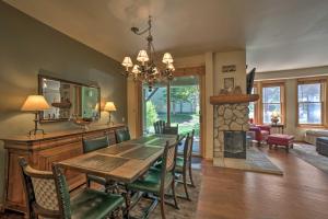 a dining room with a table and chairs and a fireplace at Mammoth Lakes Vacation Rental with Community Hot Tub in Mammoth Lakes