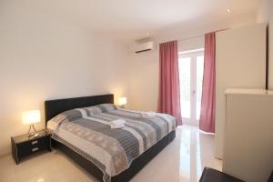 Posteľ alebo postele v izbe v ubytovaní Villa Minu + 37 fotografií