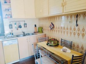 a kitchen with a table with a bowl on it at Villa Ampelia in Sitia