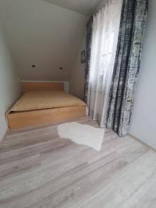 Posteľ alebo postele v izbe v ubytovaní Domek nad jeziorem