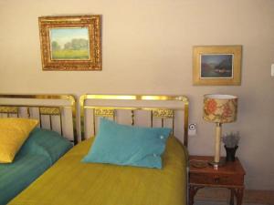 a bedroom with two beds and a blue pillow at FINCA TIERRA CALMA Casa 1 in Hilario +74 photos