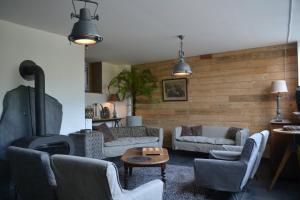 Coin salon dans l'établissement Maison du chien vert