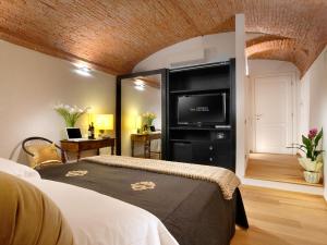Säng eller sängar i ett rum på Graziella Patio Hotel