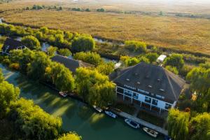 an aerial view of a house on a river at Delta Paradis Resort in Murighiol