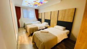 Кровать или кровати в номере Kaya Residence