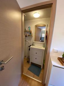 a bathroom with a sink and a mirror at Ferienwohnung Monteurwohnung Gevelsberg in Gevelsberg