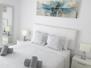 Een bed of bedden in een kamer bij Apartamento Fontanilla