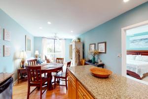 a kitchen and dining room with a bed and a table at Shipwatch 2173 in Kiawah Island
