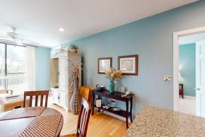 a dining room with blue walls and a table at Shipwatch 2173 in Kiawah Island +16 photos