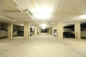 an empty parking garage with cars parked in it at Naka Residence in Phuket