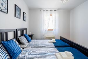 Łóżko lub łóżka w pokoju w obiekcie Downtown Apartment Helena