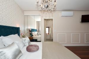 Letto o letti in una camera di Rooms Valery