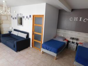 Postel nebo postele na pokoji v ubytování Le Gîte des Marguerites