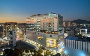 a large building in a city at night at Holiday Inn Express Seoul Hongdae, an IHG Hotel in Seoul