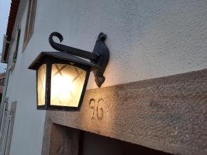 a light on the side of a building at Casa Mateus - Colares, Parque Natural Sintra Cascais in Sintra