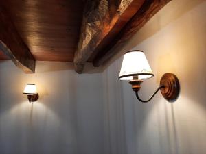 two lights on a wall in a room at Casa Mateus - Colares, Parque Natural Sintra Cascais in Sintra