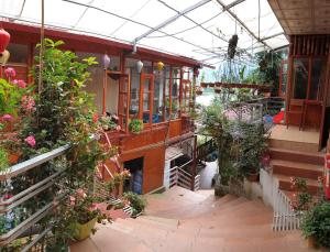 a building with a bunch of potted plants in it at Dang Khoa Homestay in Sapa