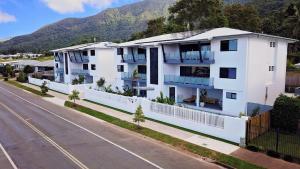 an apartment building on the side of a street at Valle Vista Luxury Apartments in Cairns