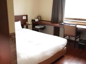 Voodi või voodid majutusasutuse Sutton Hotel Hakata City toas