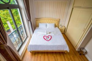 Postel nebo postele na pokoji v ubytování Maya Hotel 2