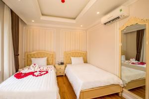 Postel nebo postele na pokoji v ubytování Maya Hotel 2