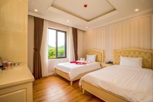 Postel nebo postele na pokoji v ubytování Maya Hotel 2