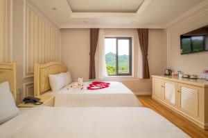 Postel nebo postele na pokoji v ubytování Maya Hotel 2