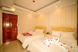 Postel nebo postele na pokoji v ubytování Maya Hotel 2
