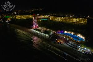 a view of a cruise ship at night at Paradise Beach Residence - Ultra All Inclusive in Sveti Vlas