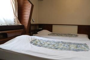 Letto o letti in una camera di Hotel Daiki