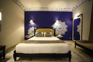 Laxmi Palace Heritage Boutique Hotel客房内的一张或多张床位