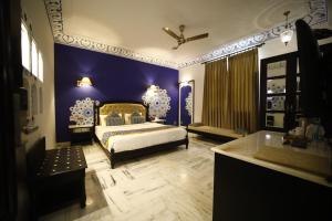 Laxmi Palace Heritage Boutique Hotel客房内的一张或多张床位