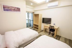 Postel nebo postele na pokoji v ubytování Fantasy Homestay