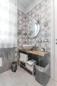 a bathroom with a sink and a mirror at B&B Il Granaio Celeste in Porto Viro +38 photos